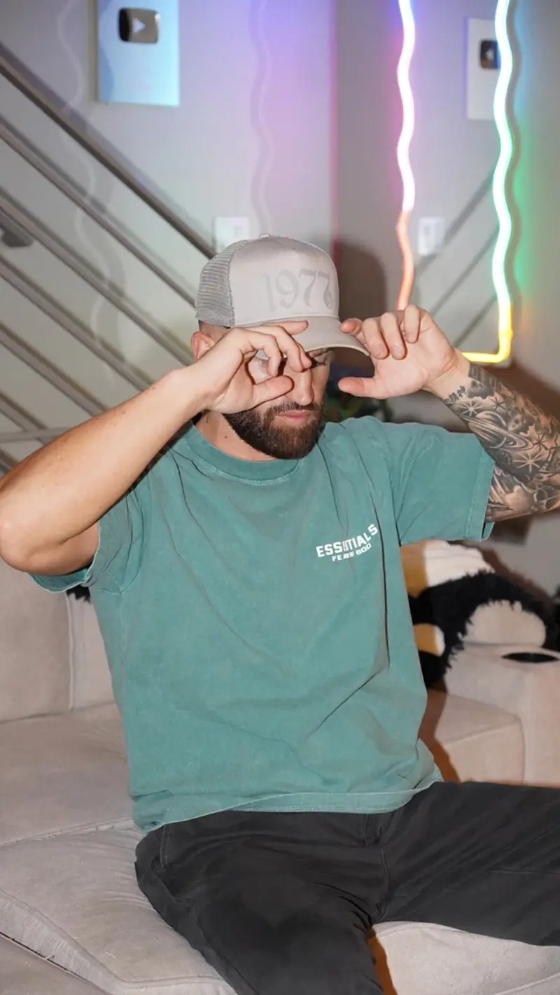 Caleb Hellinger making a heart sign with his hands