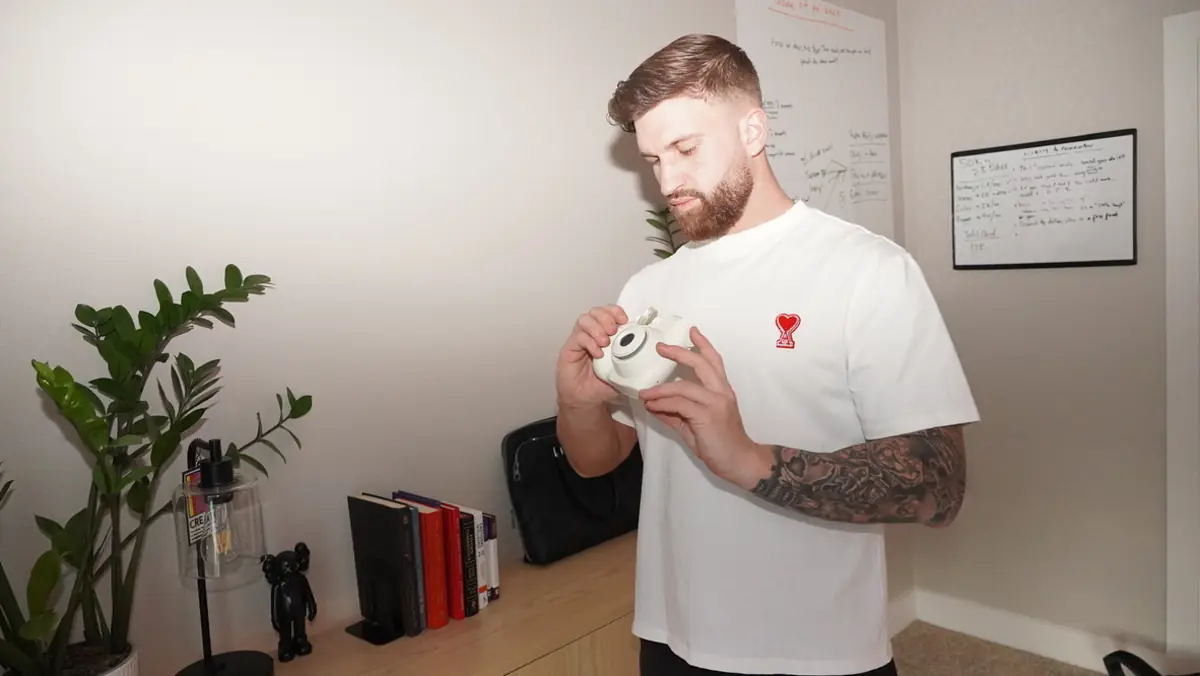 Caleb Hellinger with coffee in his office