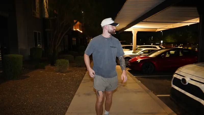 Caleb Hellinger walking toward camera at night
