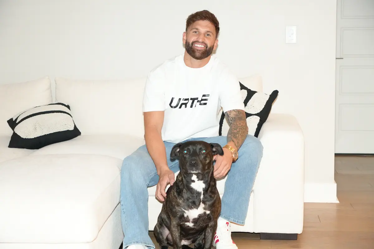 Caleb Hellinger at home with his dog
